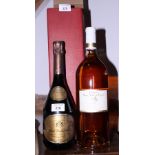 A bottle of Pierre Mignon Hotel Westminster Champagne and a magnum bottle of 2009 Domaine Saint