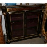 A French late 19th century boule work and ebony side cabinet with flanking columns and enclosed