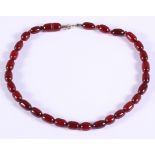 A cherry amber Bakelite bead necklace