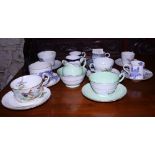 A collection of various English porcelain coffee cans and saucers, including Royal Worcester "Blue