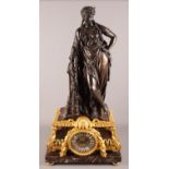A late 19th century bronze and ormolu mounted mantel clock with classical figure surmount, woman