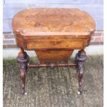 A Victorian figured walnut and line inlaid fold-over top gaming table, the interior with backgammon,