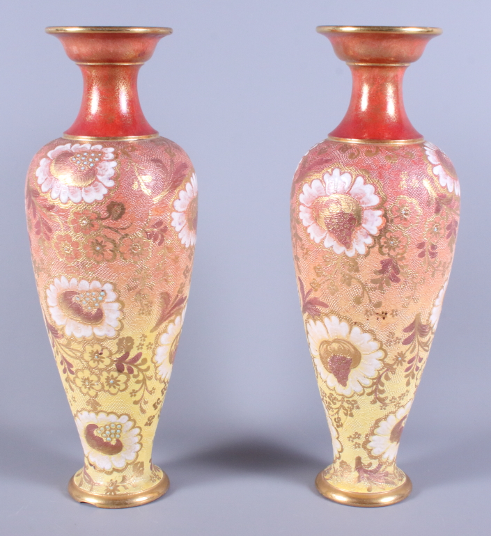 A pair of Doulton & Slaters Patent stoneware vases, in yellow and orange colouring with gilt painted