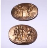 A pair of 19th century gilt metal oval brooches, panels with cherubs and Putti, 2 3/4" x 1 1/4"