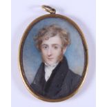 An early 19th century portrait miniature of an unknown gentleman with gold stick pin, 2.25" x 2.