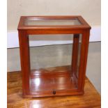 A glazed mahogany display cabinet with lift up side panel, 13" wide