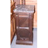 A late Victorian oak Aesthetic movement bedside cupboard enclosed panelled door with marble top, 16"