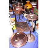 A late Victorian copper kettle with brass handle, a brass trivet, on tripod base, a copper warming