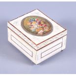 A tortoiseshell and ivory trinket box, the lid inset with miniature still life of flowers