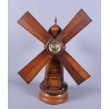 An antique scratch built wood and brass mounted model of a windmill, 19" high overall