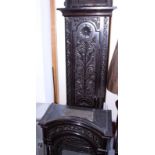 A late 19th century carved oak long case clock with eight-day striking and chiming on bells and