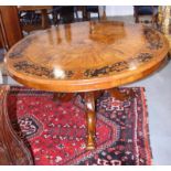 A late 19th century walnut and marquetry work circular tilt top dining table with central panel of