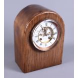 An oak dome top cased mantel clock with eight-day striking movement, 11" high, and a burr yew and