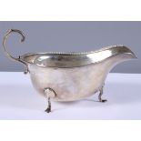 A silver gravy boat with 'C' scroll handle and beaded rim, Collingwood & Sons Ltd, Birmingham