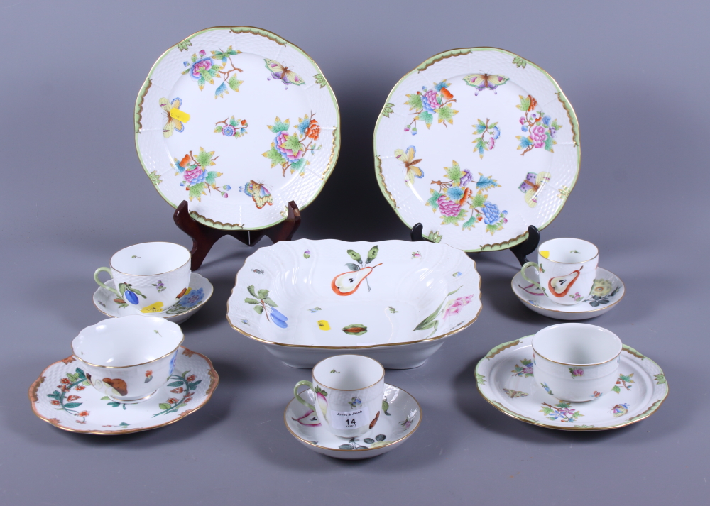 Twelve pieces of Herend hand-painted porcelain, including plates, bowls, etc
