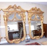 A pair of carved giltwood framed wall mirrors, William Kent design with eagle surmount, broken