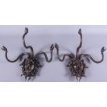 A pair of 20th century bronze hanging coat hooks, in the form of Medusa, 11" wide