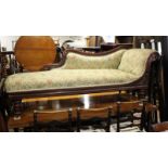 A late 19th century walnut showframe chaise longue with scroll back, upholstered in a floral fabric,