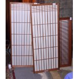 A pair of Japanese pine and paper screens, 40" x 15", together with a smaller similar screen, 30"
