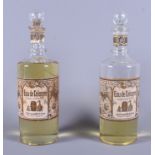 A pair of early 20th century Eau de Cologne "Golden Still" perfume bottles and stoppers, some with