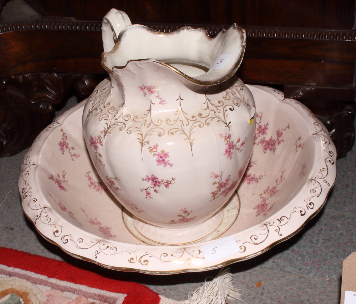 A Victorian floral transfer decorated toilet jug and bowl