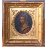 An early 19th century portrait miniature of a young woman, possibly Eastern European, wearing a