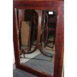 A wall mirror, plate 19" x 27", in deep polished as walnut frame, and a triple plate toilet mirror