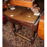 A late Georgian oak drop leaf dining table, on gate leg turned and stretchered supports, 45" wide