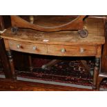 A Georgian mahogany and ebony box line inlaid bowfront side table, fitted two drawers, on turned and