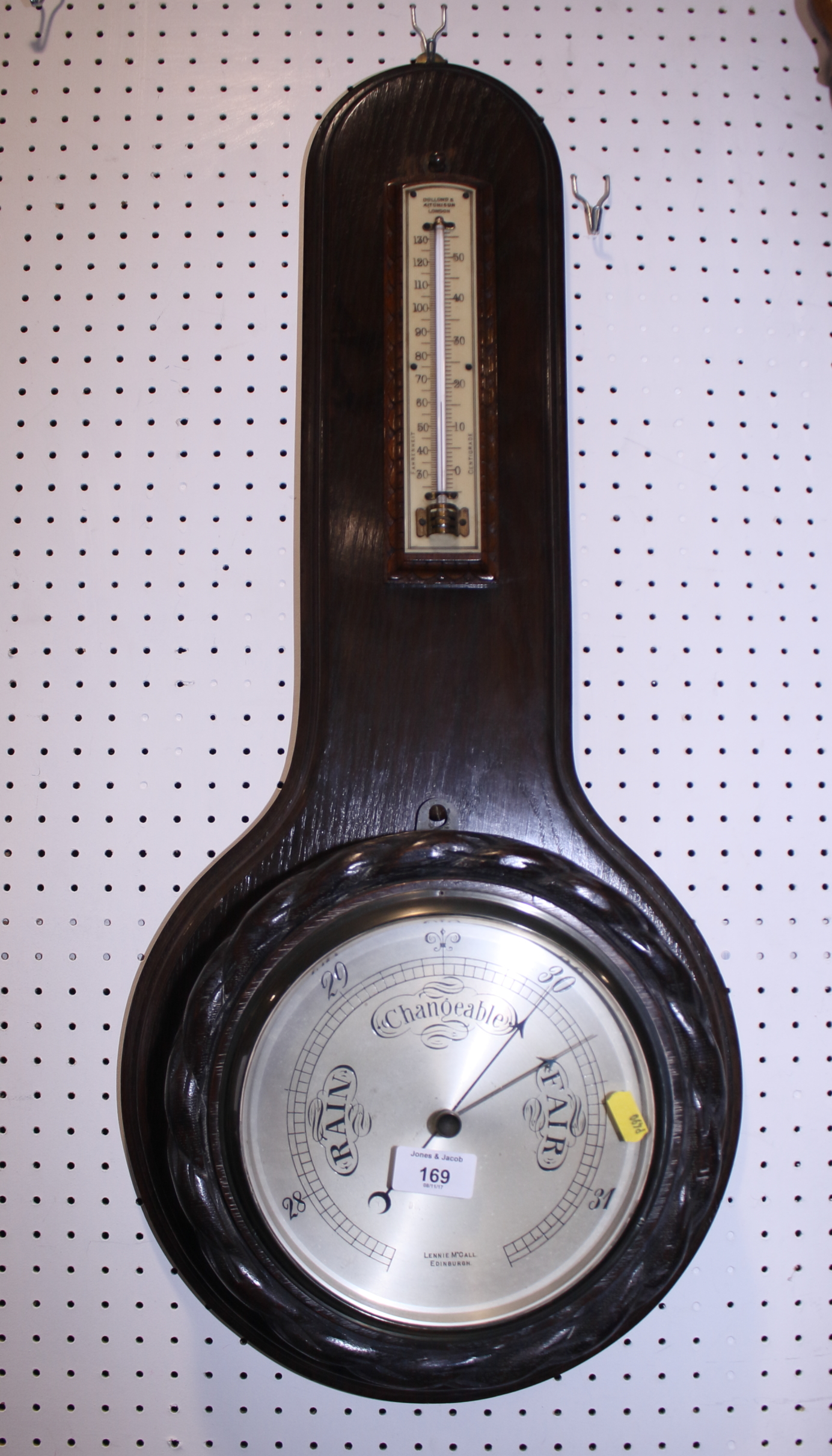 A 19th century walnut cased German mantel clock with brass dial, cherub corners and black