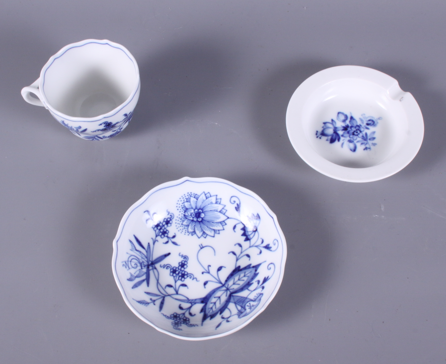 A Meissen blue and white decorated coffee cup, a similar saucer and ashtray - Image 2 of 3