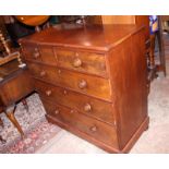 A Victorian mahogany chest of two short and three long graduated drawers with knob handles, on bun