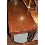 A 19th century mahogany drop leaf dining table, on square supports, 42" x 60" when fully extended