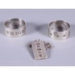 A matched pair of plain hallmarked silver napkin rings, J B Chatterley & Sons Ltd, together with a