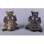 A pair of late 19th/early 20th century painted cast iron door stops, each in the form of a man's