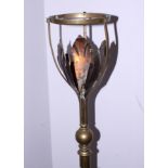 An early 20th century brass telescopic standard lamp, in the manner of W A S Benson, on three