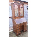 A burr walnut and banded double dome top bureau bookcase of Queen Anne design, the upper section