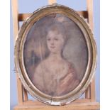 A late 18th century watercolour, portrait of an unknown woman with red cloak, 11" x 9", in oval gilt