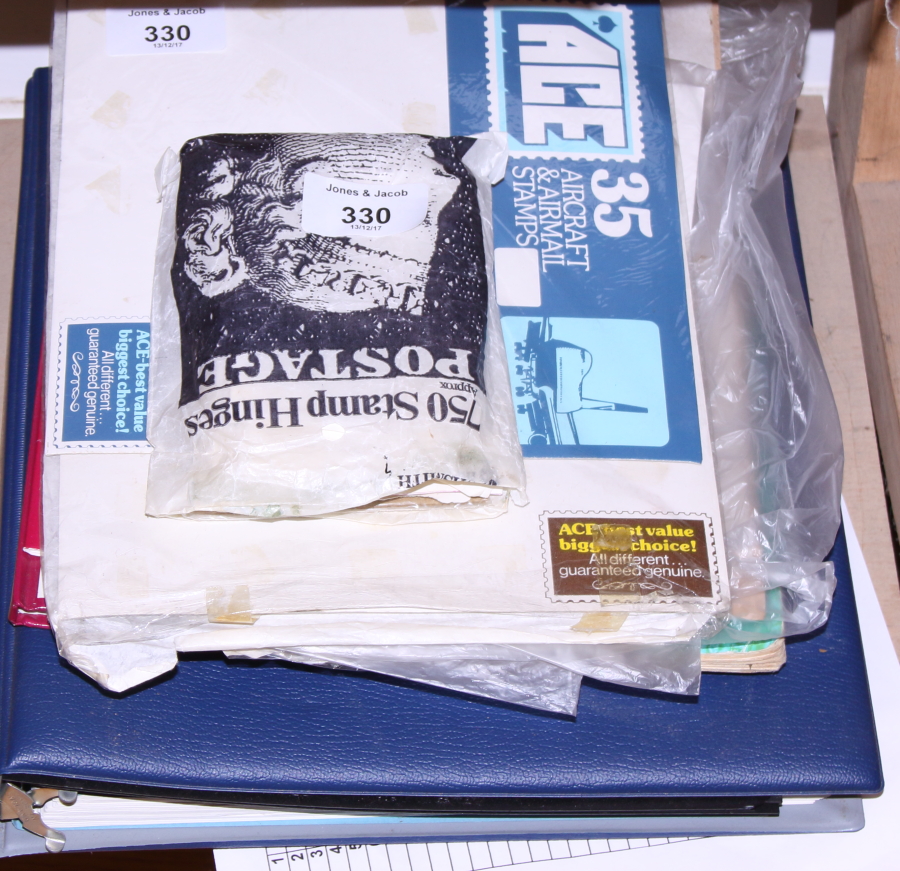 Two mid 20th century stamp albums, a larger similar stamp album and a number of loose first day
