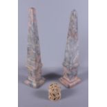 A pair of grey and russet coloured marble obelisks, on square plinth bases, 13" high, together