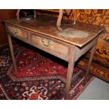 A Georgian oak side table, fitted two drawers, on square supports, 35" wide