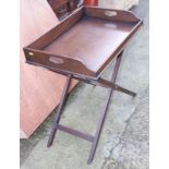 A butler's mahogany tray, on folding stand, 26" wide