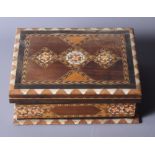 An early 20th century Egyptian marquetry inlaid fold-over chess board/box, complete with turned