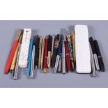 A collection of various fountain and rollerball pens, mainly Parker and Cartier