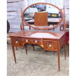 An Edwardian mahogany and kingwood banded break bowfront dressing table, fitted oval mirror over