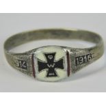 A WW1 German white metal ring with black enamel iron cross upon white flanked by two red enamel