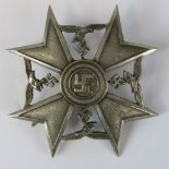 A WW2 Nazi Spanish Cross badge with no markings verso; 5.5cm long.