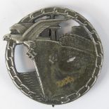 A WW2 Nazi German Blockade Breaker metal badge; stamped "Richard Feix Gablonz a.d.N." verso; 4.