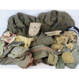 A selection of British Army uniforms and American pouches.