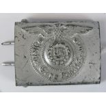 A WW2 German army belt buckle stamped "RZ 155-43 SS"; 6.5cm wide.